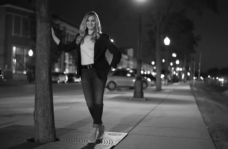 Lisa Jackson in front of railroad tracks.